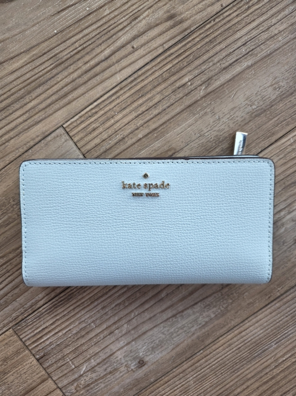 kate spade light blue zip-around pebbled leather wallet